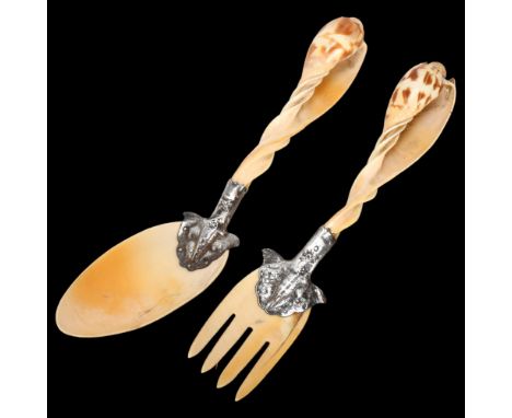 A pair of Continental silver-mounted shell salad servers, spoon 23cmNo chips or damage, fork has a natural crack in blade 