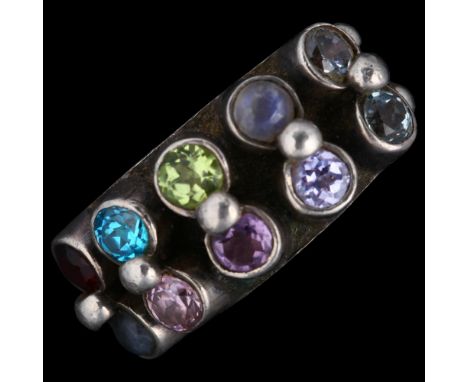 KUMKUM - a Swedish sterling silver gem set band ring, band width 10.8mm, size N, 11gNo damage or repair, all stones present, 