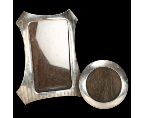2 silver-fronted photo frames, comprising shaped engine turned example, Birmingham 1916, and small circular example, Birmingh