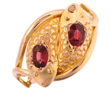 An early 20th century 9ct rose gold garnet double coiled snake ring, maker CYBS, Chester 1912, setting height 14.9mm, size T,