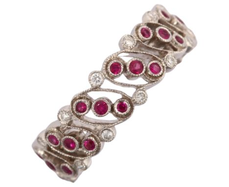 LUKE STOCKLEY - an 18ct white gold ruby and diamond full eternity ring, in Art Deco style, pierced oval openwork panels set w