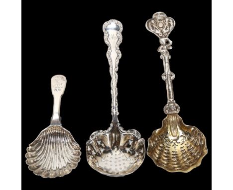 A William IV Scottish silver shell caddy spoon, and 2 decorative cast-silver sifter spoons, largest 16cm, 4oz total (3)Caddy 