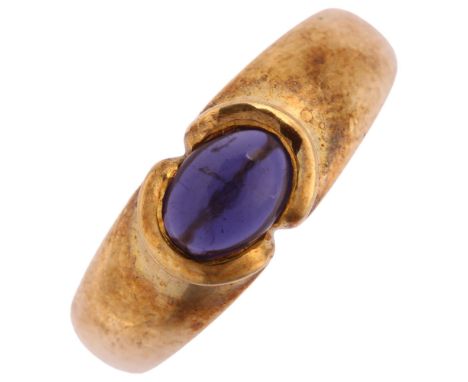 A modern 9ct gold iolite dress ring, Birmingham 2006, bezel set with oval cabochon iolite, setting height 6.9mm, size N, 4.1g