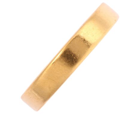 An 18ct gold wedding band ring, band width 3.9mm, size P, 5.3gNo damage or repair, only light surface wear, stamped 18ct 