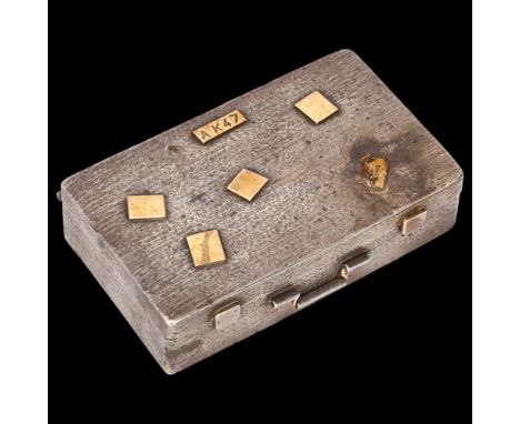 A good quality silver and gold suitcase box, allover textured decoration with applied gold "travel label" patches, swing hand