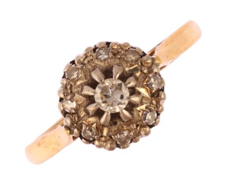 An 18ct gold diamond target cluster ring, set with modern round brilliant and single-cut diamonds, total diamond content appr