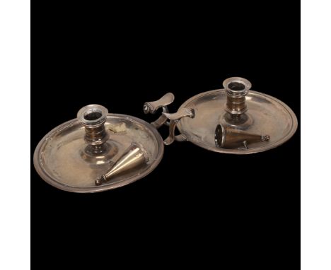 A pair of George III silver chamber sticks, Ebenezer Coker, London 1766, with later silver snuffers, diameter 16cm, 18.2oz to