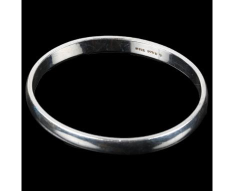 HORSENS SOLVVAREFABRIK - a Danish sterling silver plain form bangle, band width 7mm, internal circumference 19cm, 37.2gNo dam
