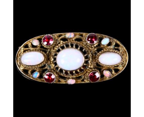 An Austro-Hungarian silver-gilt opal and garnet openwork brooch, 40mm, 7.9gNo damage or repair, all stones present, fitting w