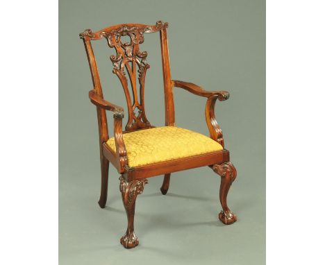 A child's armchair, in the Chippendale style, with carved and pierced splat back, drop in seat and raised on cabriole legs te