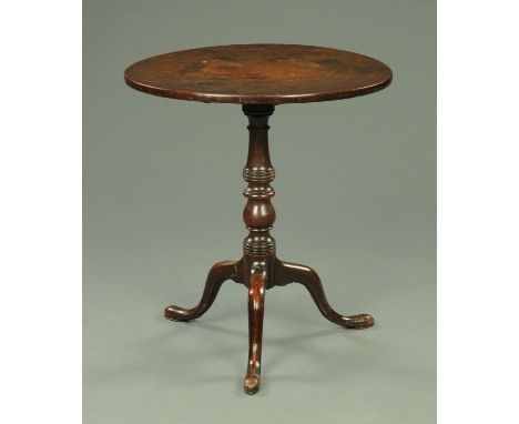 A Georgian mahogany snap top tripod table, with turned column and three downswept legs terminating in pad feet.  Diameter 66 