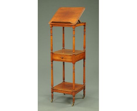 A George III mahogany three tier whatnot, with single shelf beneath the middle tier and raised on short legs with brass casto