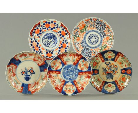 Five Japanese Imari scalloped plates, late Meiji/early Taisho, in typical Imari colours, 21.5 cm diameter. CONDITION REPORT: 