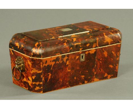 A George III tortoiseshell tea caddy, early 19th century, the rectangular top with canted corners and inset to the centre wit