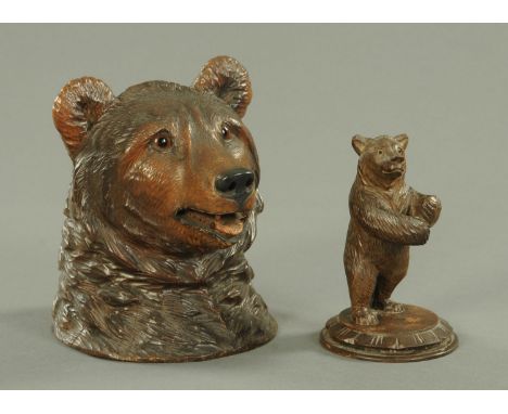 A Swiss "Black Forest" carved wood bear novelty ink well, late 19th century, with coloured glass inset eyes, height 15 cm, to