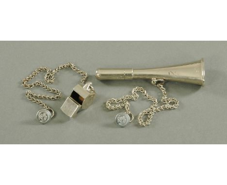 A French train guards whistle, 20th century, of flattened trumpet form, struck S.N.C.F. upon a plated chain with S.N.C.F. but