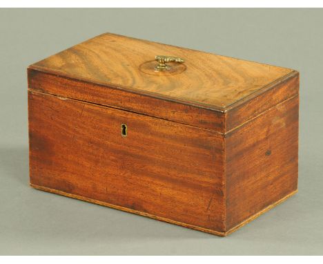A George III mahogany tea caddy, the lid with brass handle opening to reveal a further interior lid with two removable linen 