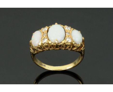 An 18 ct gold opal and diamond ring, hallmarked, size N.