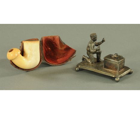 A metal match holder in the form of a shoeshine boy, and a Meerschaum pipe bowl only, cased. 