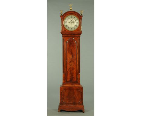 A George III mahogany longcase clock, with circular dial and two-train striking movement, the long trunk door with applied mo