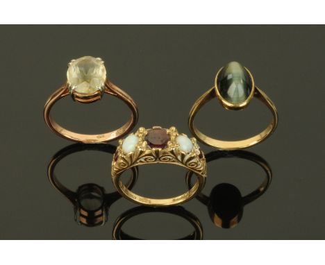 Three 9 ct gold rings, garnet and opal, tigers eye and citrine.