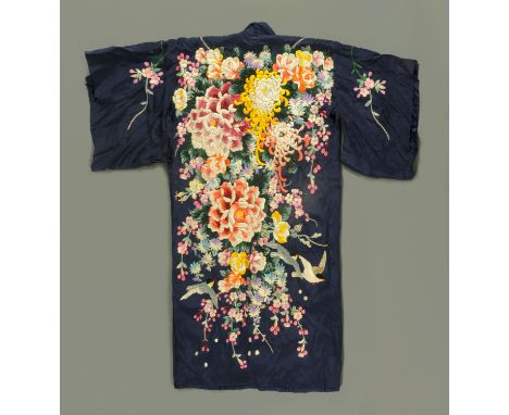 A Japanese silk Kimono, early 20th century, finely embroidered with roses, peony, chrysanthemums and other flowers all agains