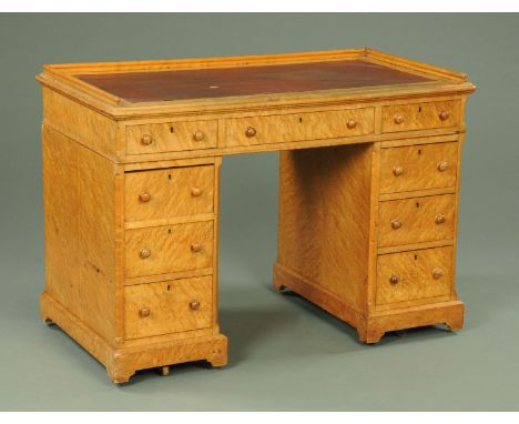 A Victorian maple pedestal desk, with three quarter gallery, three frieze drawers and three further drawers to each pedestal.