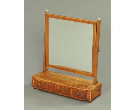 A mahogany dressing table mirror, early 19th century, with turned bone finials flanking the square mirror glass with boxwood 