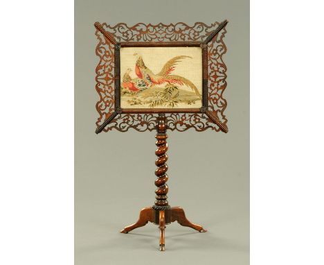 A Regency rosewood face fire screen, with fretwork surround to the golden pheasant panel and with turned support and three do