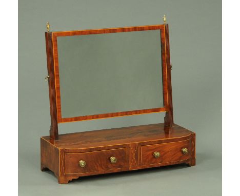 A George III inlaid mahogany dressing table mirror, fitted with two drawers to the base and raised on bracket feet.  Width 64