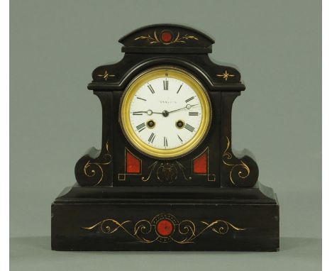 A Victorian black slate mantle clock, by Fattorini & Sons, with two-train striking movement.  Width 29 cm.  CONDITION REPORT: