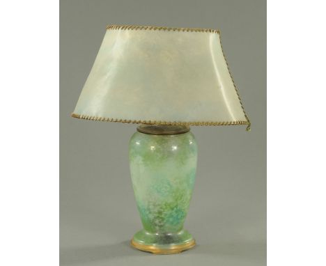 A Monart attributed green glass table lamp, early 20th century, having a mottled green/turquoise and black ground with brass 