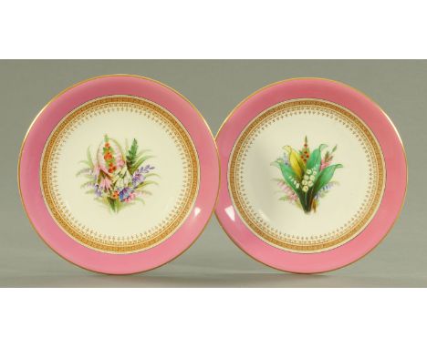 A pair of Royal Worcester porcelain desert plates, date code for 1881 and 1883 each with hand painted floral bouquet within a
