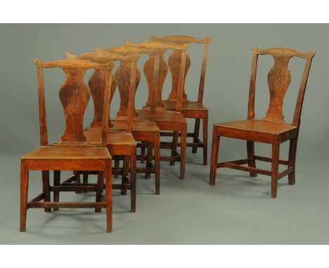 A set of six George III country oak Chippendale style splat back dining chairs, with solid seats and tapered legs of square s