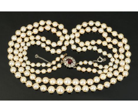 A double strap of cultured pearls, with spinel set clasp.   CONDITION REPORT: The largest pearl is approximately 7 mm in diam