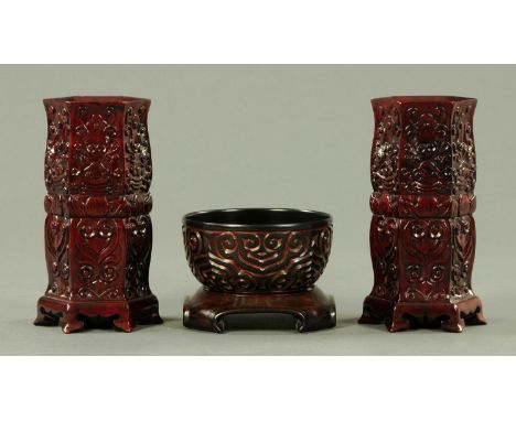 A pair of Chinese carved Hongmu vases, circa 1960/70, each with relief carved scroll decoration with integral Ruyi head feet,