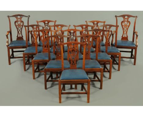 A set of fourteen Edwardian mahogany Chippendale style dining chairs, two arm and twelve single, two bearing plaques "Hewetso