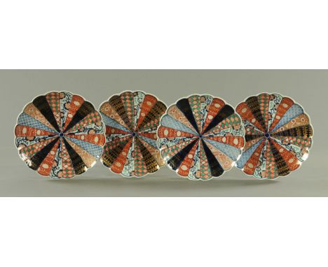 A set of four Japanese four Imari scalloped dishes, circa 1890/1900, with panels of Karakusa, foliate fronds, trellis and loz