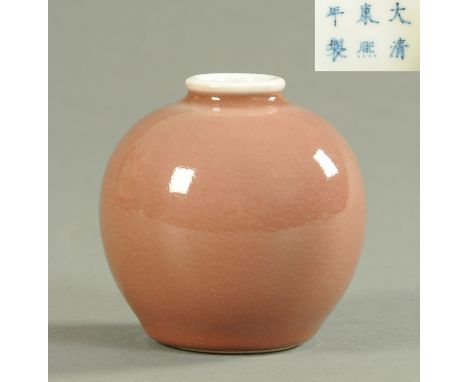 A Chinese peach bloom ground vase, 20th century, of ovoid form, with pseudo six character Kangxi marks to the underside, heig