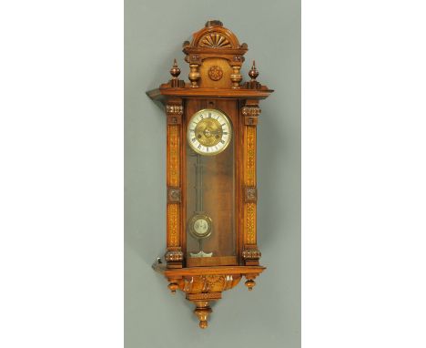 A 19th century Vienna style regulator wall clock, with stencilled case and two-train spring driven movement.  Height 96 cm, w