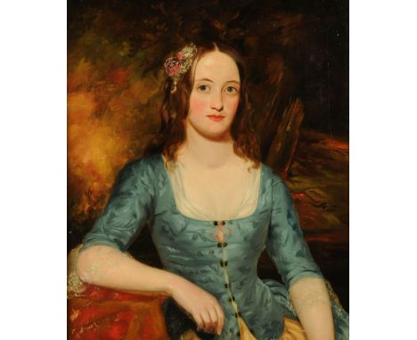 19th century English School, half length portrait of a Victorian beauty holding a blue dress and seated before a woodland bac