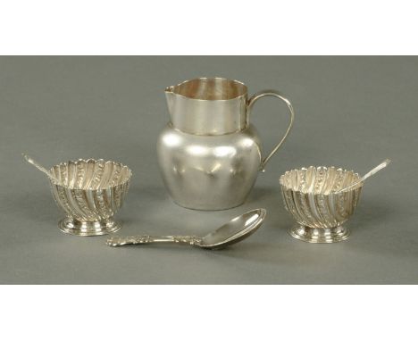 A pair of silver salts, George Maudsley Jackson, each with a wrythen body and two Albany patterned spoons, a silver cream jug