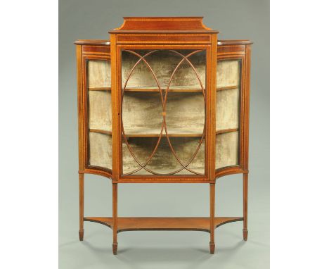 An Edwardian inlaid mahogany display cabinet, with rear upstand, the centre glazed door with wooden astragals flanked by conv