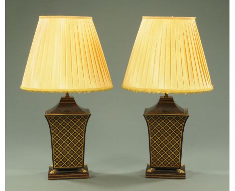 A pair of Regency Toleware style table lamps, 20th century, of square tapering form, with gilt geometric cell pattern against