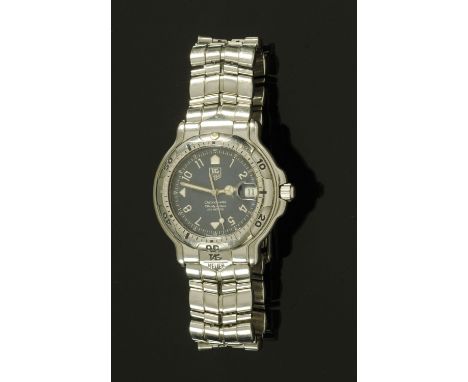 A Tag-Heuer automatic chronometer with date, in stainless steel case, with certificate No. 5648971, Movement No. 167631, with