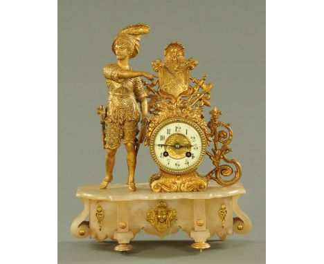 A gilt spelter mantle clock, late 19th century, modelled as a Continental soldier with two axes beside a shield with war trop