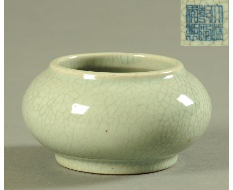 A Chinese Ge glazed brush pot, 20th century, with grey green/celadon ground, with blue pseudo Qianlong seal mark to the under