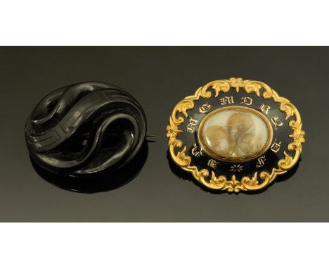 A Victorian mourning brooch, the centre set with three scrolls of hair with gilt wiring framed with gilt letters "in memory o