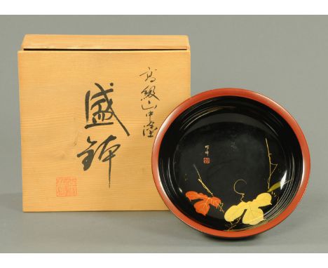 A Chinese lacquered fruit bowl, circa 1970's, the interior with leaf decoration, two character signature and red seal mark, i