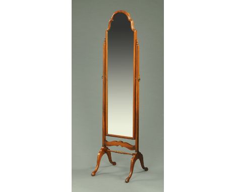 A mahogany framed cheval mirror, with turned wooden finials to each support and raised on downswept legs terminating in pad f